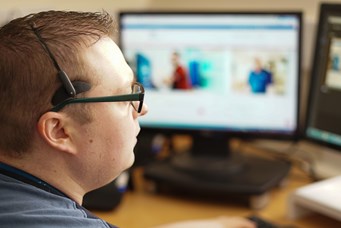 Man at computer workstation
