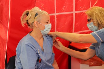 Woman being vaccinated